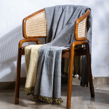 Black-Nugget-Gold Throw on a Wooden Chair