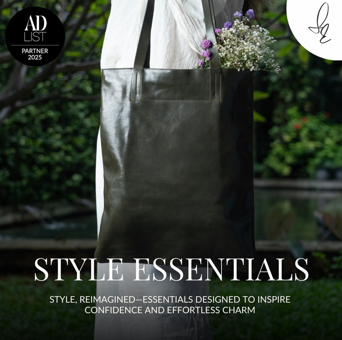 Person wearing a dark Leather tote olive green with a floral arrangement, with 'Style Essentials' text overlay.