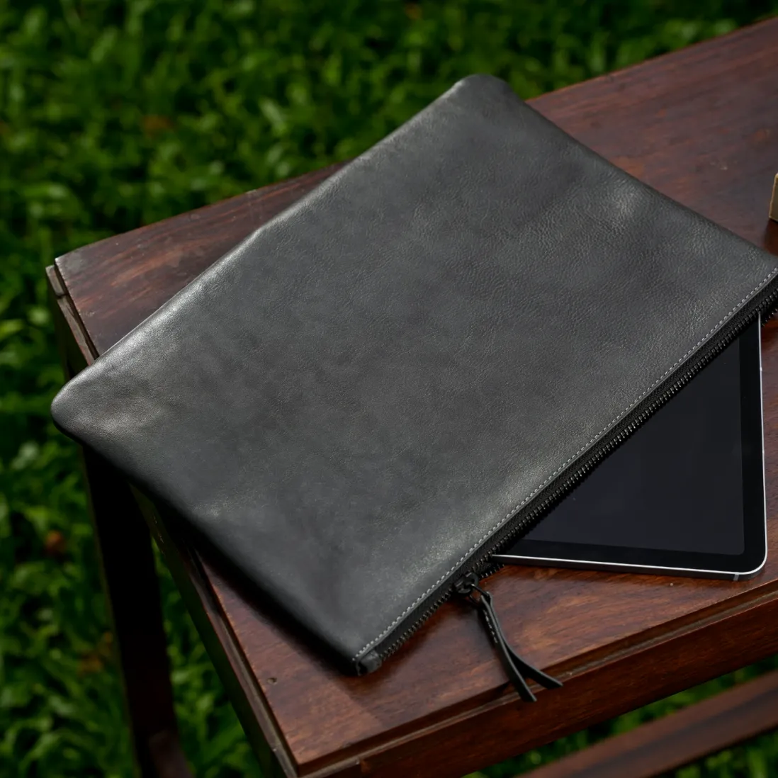 Genuine Leather iPad Cover Clutch in Dark Grey on Wooden Table