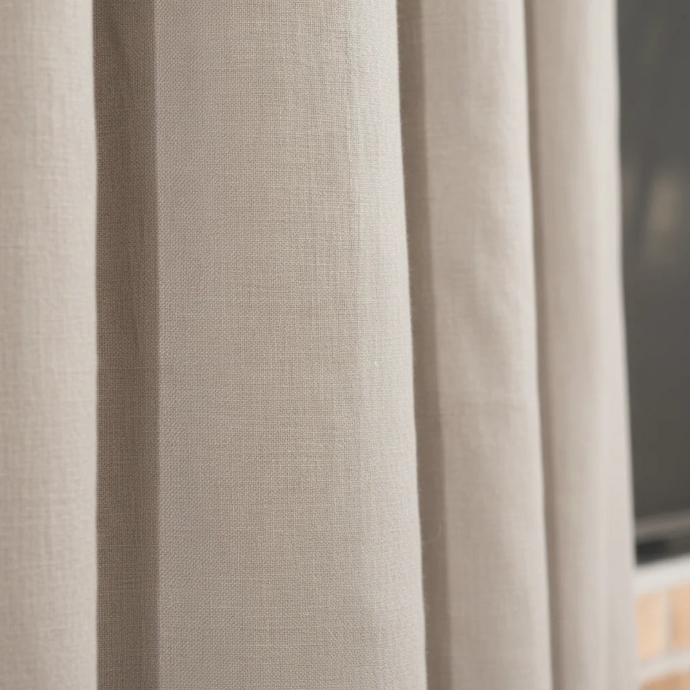 Close-up of beige curtains with a blurred background