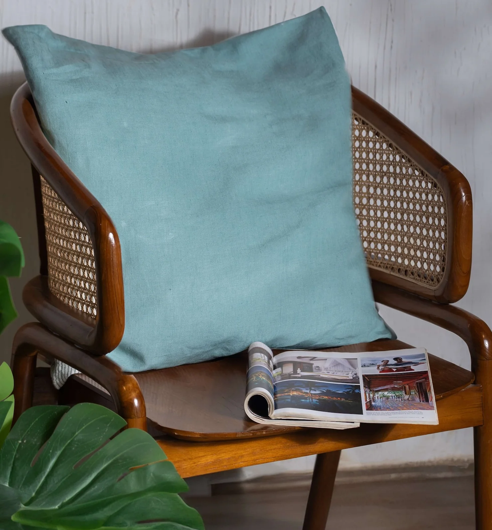 Blue Surf Linen Cushion Cover on a wooden chair