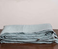 Blue Surf Linen Duvet Covers On a Wooden Table