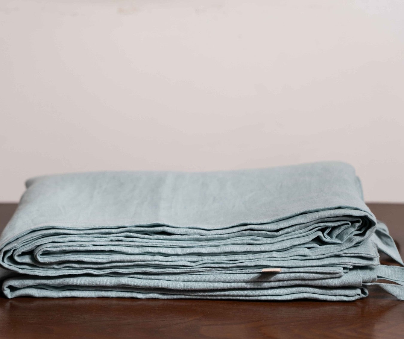 Blue Surf Linen Duvet Covers On a Wooden Table