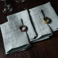 Blue Surf Linen Napkins On a Wooden Table