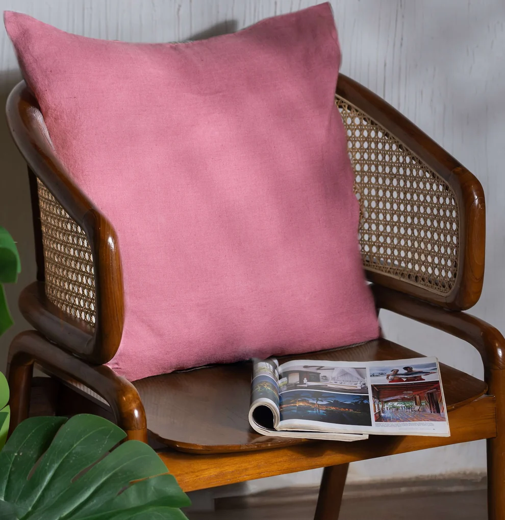 Dusty Rose Linen Cushion Cover on a wooden chair