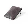 A dark brown genuine leather iPad cover with a textured surface