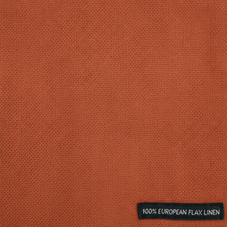 Brown fabric with a label indicating 100% Belgian linen