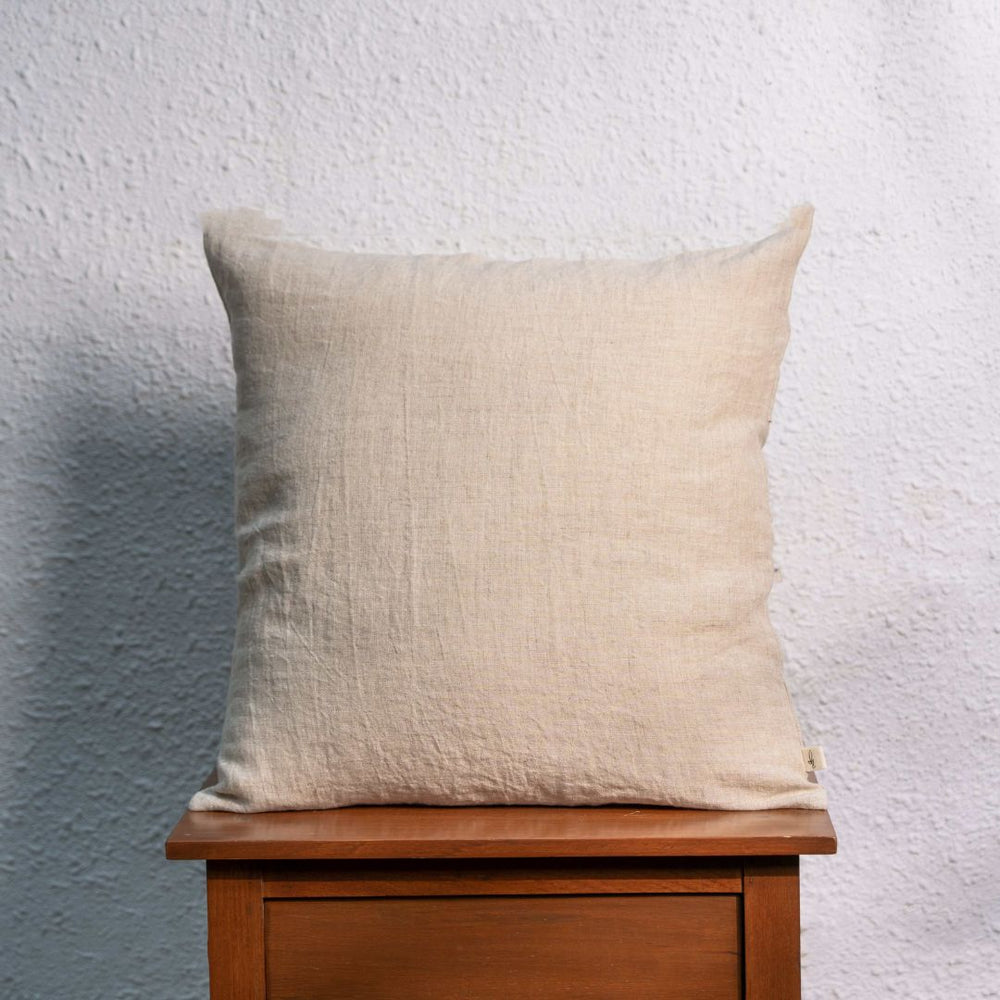 Natural (Beige) Linen Cushion Cover on a Table