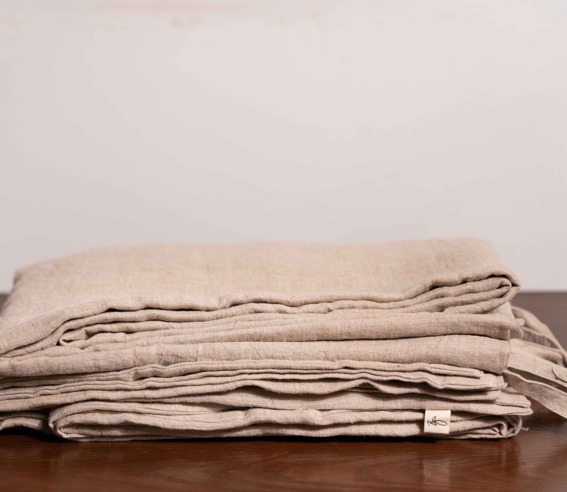 Natural (Beige) Linen Duvet Covers On a Wooden Table