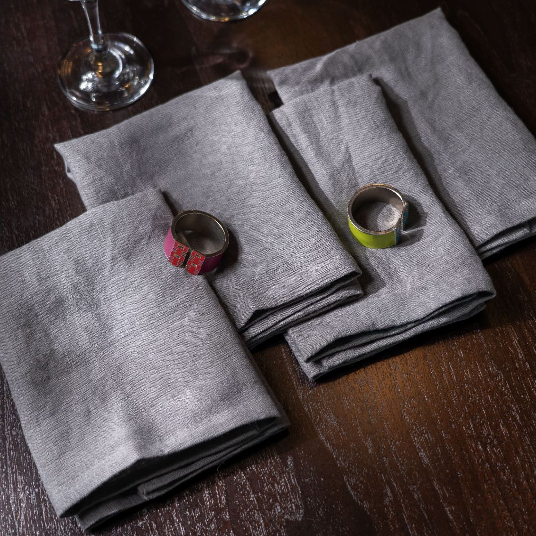 Pewter Linen Napkins On a Wooden Table