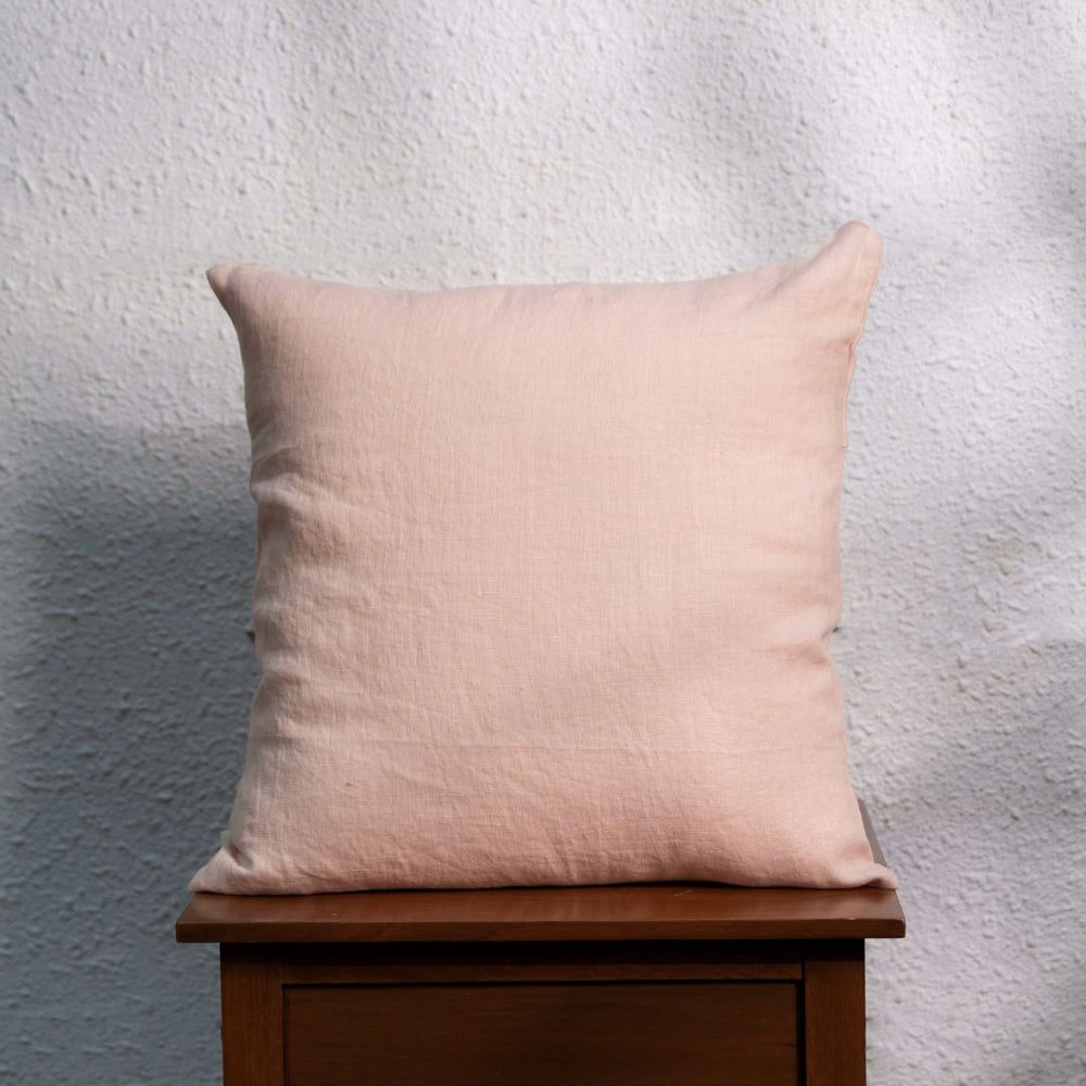 Rose Cloud Linen Cushion Cover On a Wooden Table