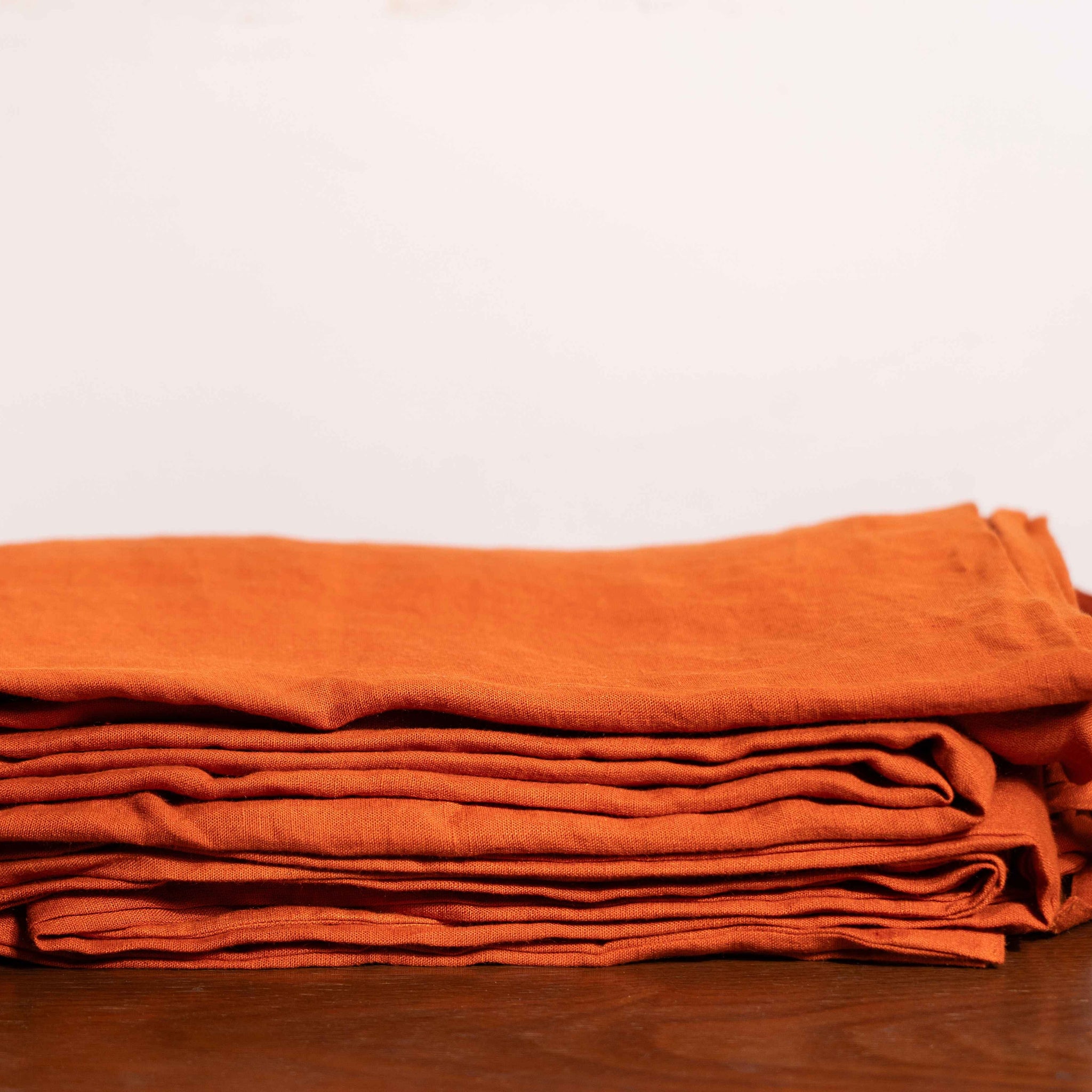 Rust Orange Linen Duvet Covers On a Wooden Table
