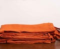 Rust Orange Linen Duvet Covers On a Wooden Table