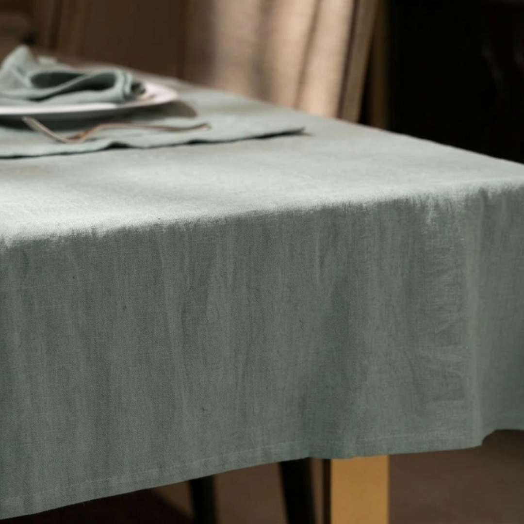 Gray textured tablecloth on a table with a blurred background