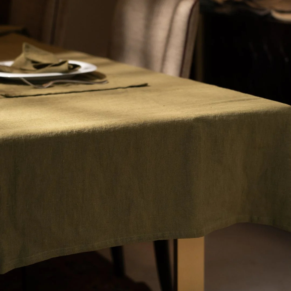 Green tablecloth on a table with a blurred background