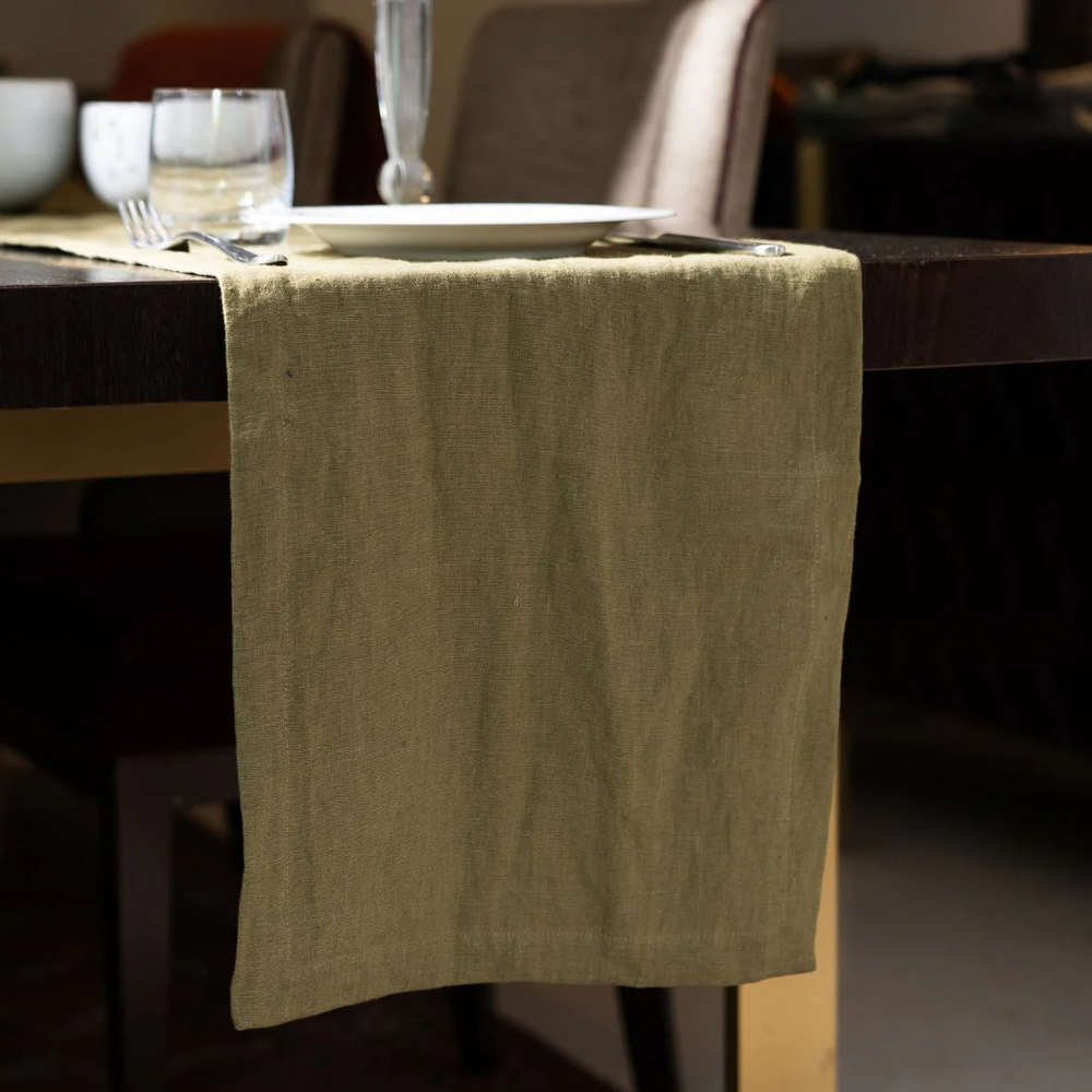 Beige napkin on a wooden table with blurred background