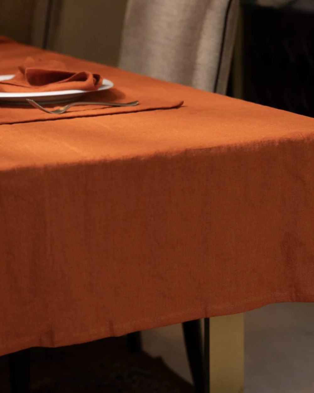 Orange tablecloth on a table with a blurred background