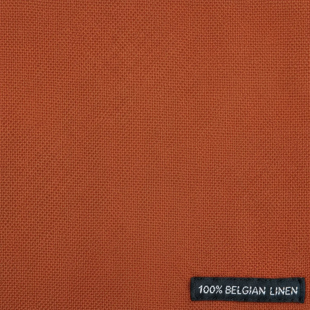 Brown fabric with a label indicating 100% Belgian linen