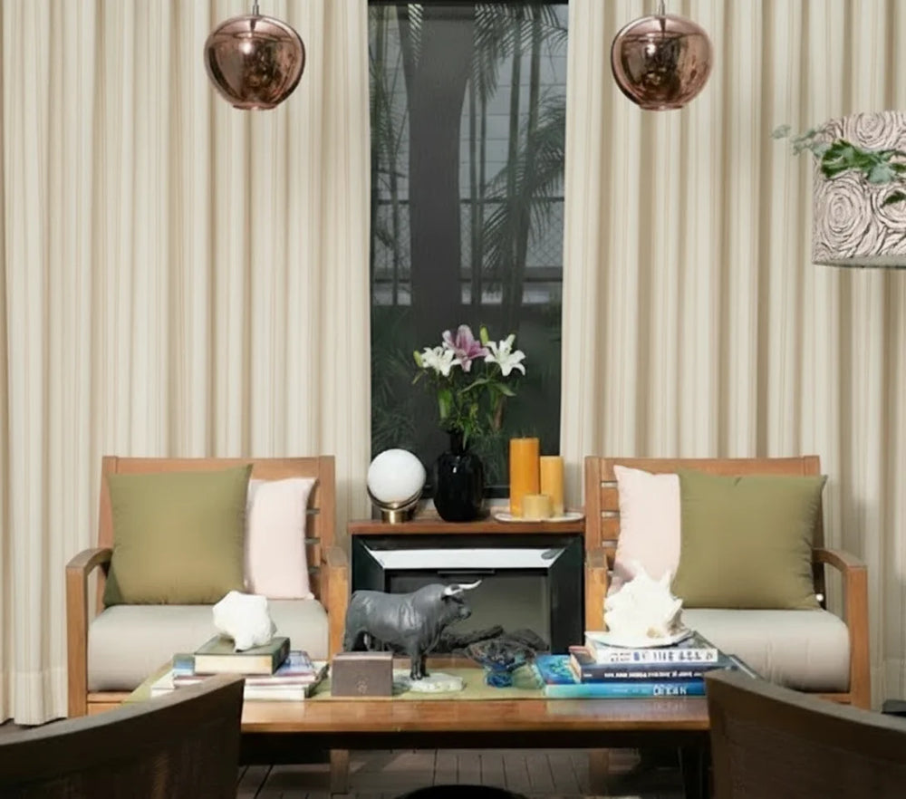 Modern living room with wooden chairs, a coffee table, and decorative items.