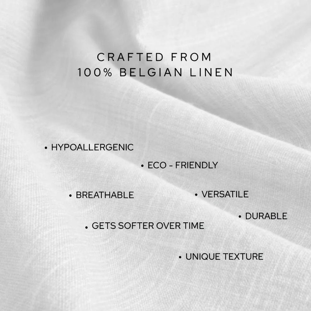 Text on white fabric stating 'Crafted from 100% Belgian linen' with listed benefits.